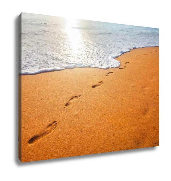 Footprints On Sandy Beach